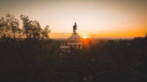 Photo of Hermann Monument overlooking valley with sunrise behind